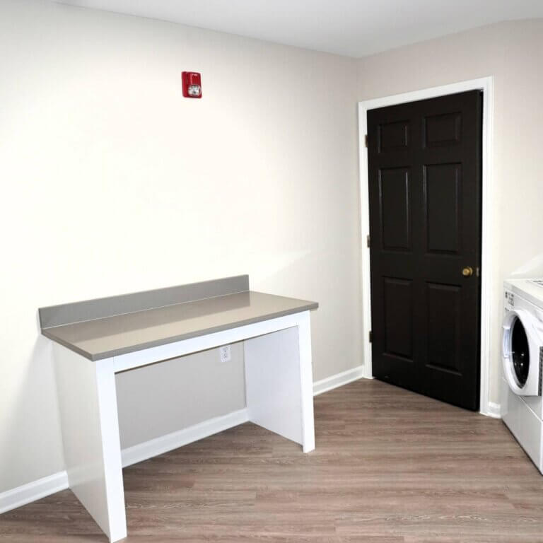 laundry room at Columbia High Point Senior Apartments in Atlanta GA