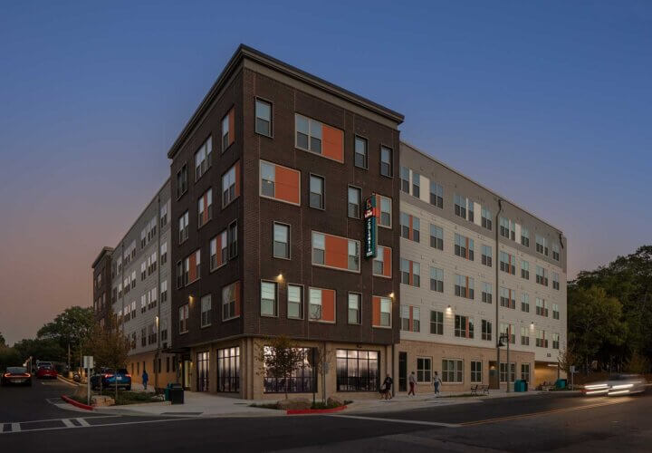 twilight view of the exterior of The Link at Columbia Senior Residences in Decatur Georgia