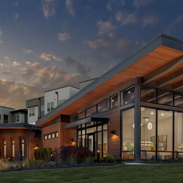 exterior view at twilight at Gardenside at the Villages of East Lake apartments in Atlanta